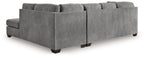 Light gray sectional sleeper sofa with tufted back pillows and wide arms, block feet