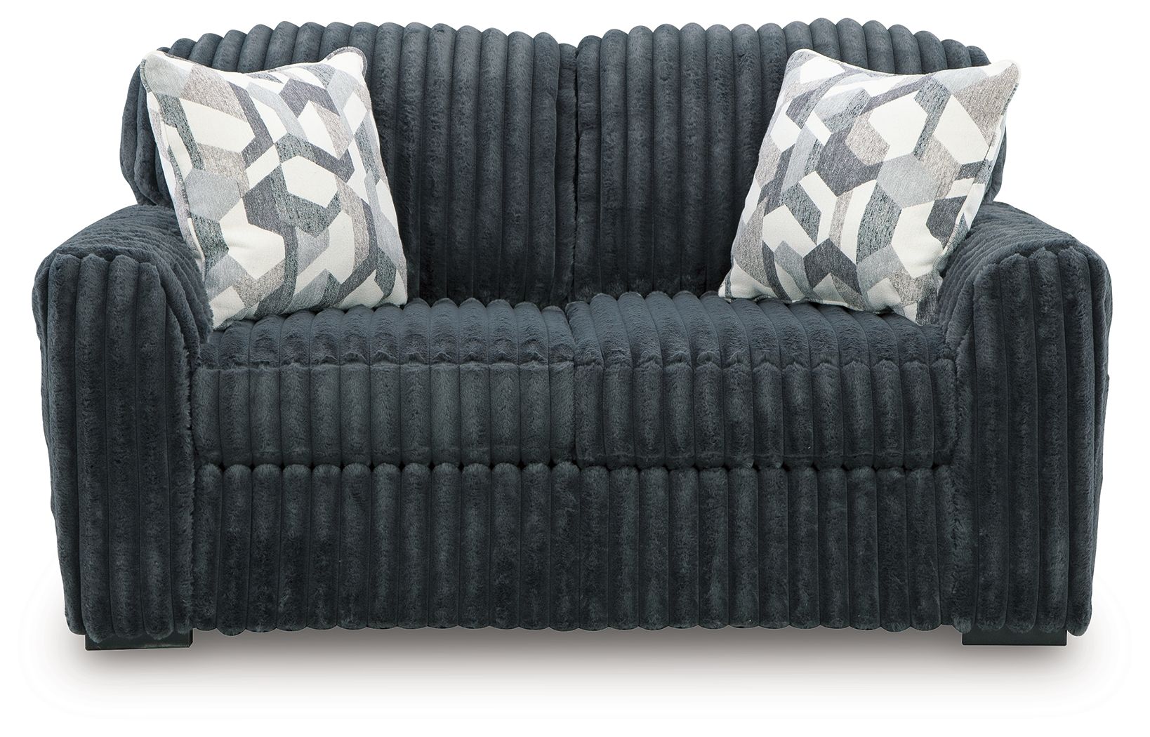 Dark gray corduroy loveseat with two patterned pillows and tufted seat cushion