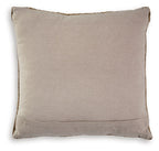 Light beige square fabric pillow with tan piping and stitched hem