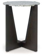 Round accent table with speckled white tabletop and four dark side legs