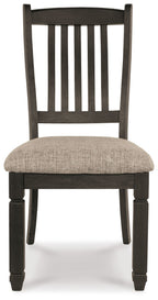 Slatback dining chair with beige upholstered seat and dark wood legs, front view