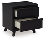 Black two-drawer night stand with drawers open, revealing light interior lining
