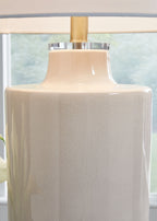 Off-white ceramic lamp base with glossy top and drum fabric shade