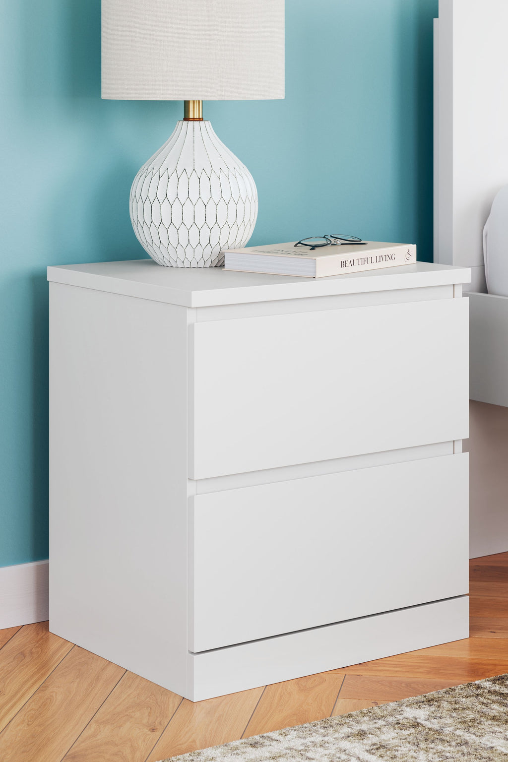 White two-drawer nightstand with wide drawer faces and smooth edges