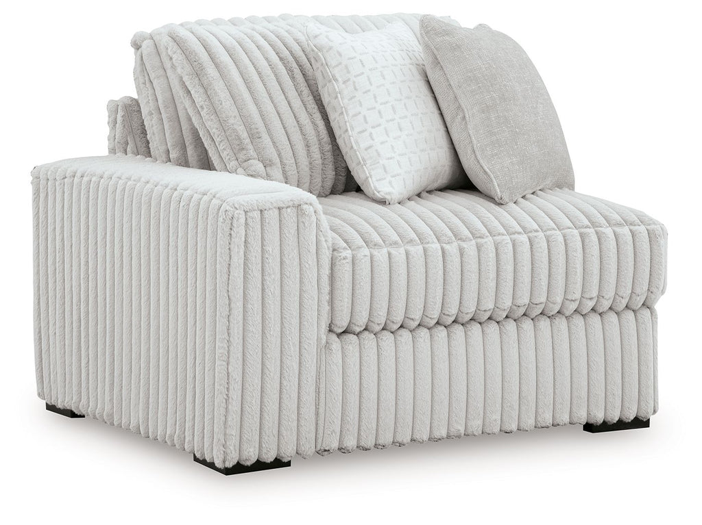 Upholstered corner chair with ribbed light-gray fabric and two back cushions