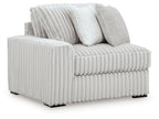 Upholstered corner chair with ribbed light-gray fabric and two back cushions