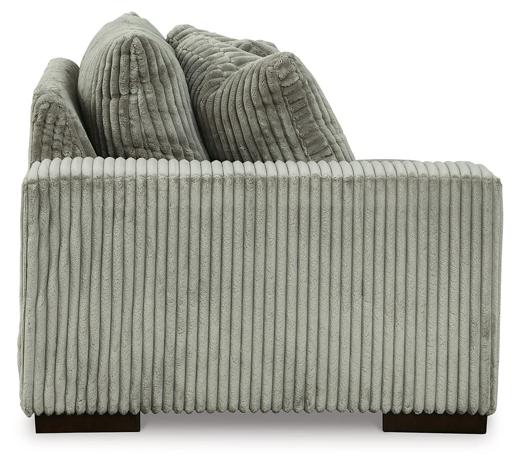 Fog gray corduroy corner chair with rounded arms and two back cushions