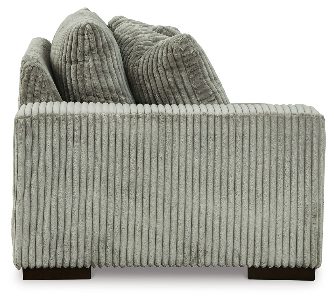 Fog gray corduroy corner chair with rounded arms and two back cushions