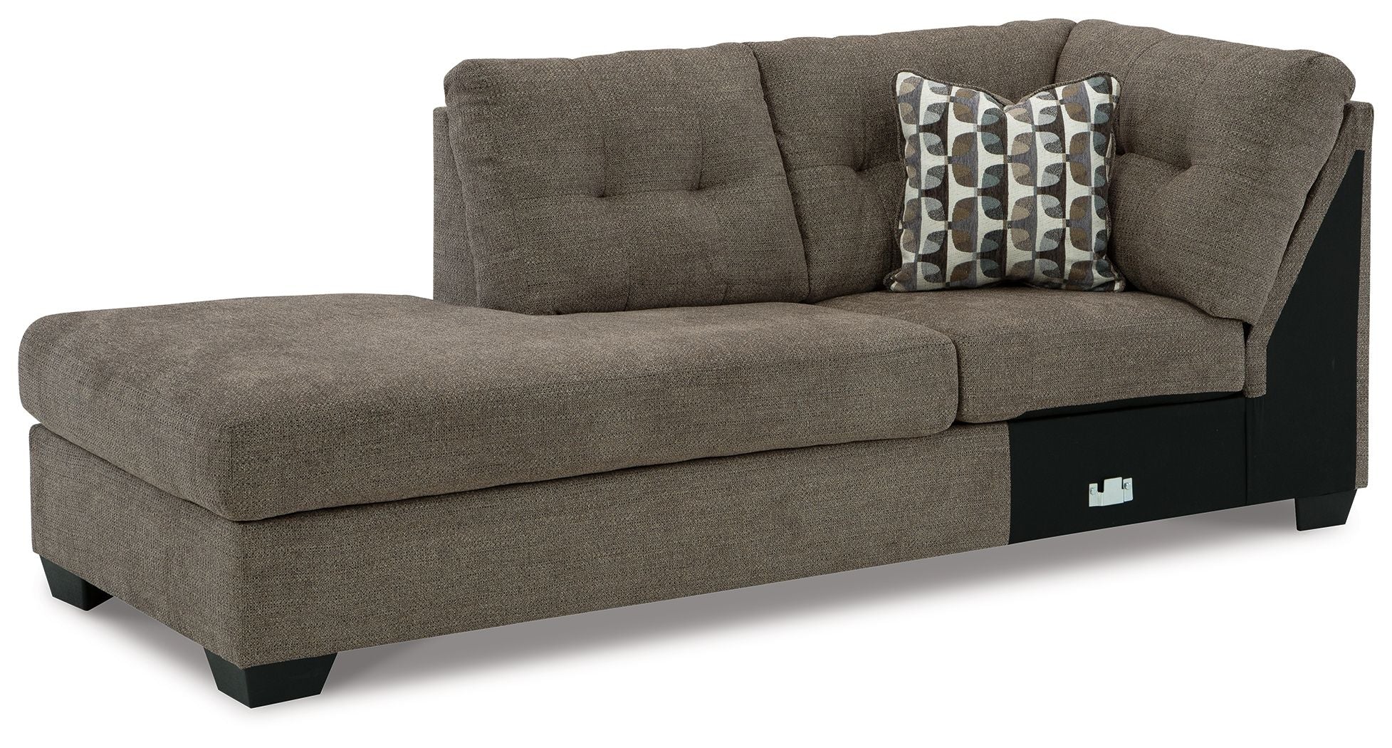Brown corner chaise with tufted back and patterned throw pillow