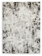 Greyland area rug with distressed black and light-gray abstract pattern
