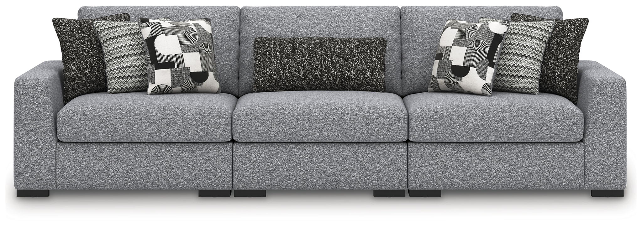 Gray sectional sofa with three-seat center and patterned throw pillows