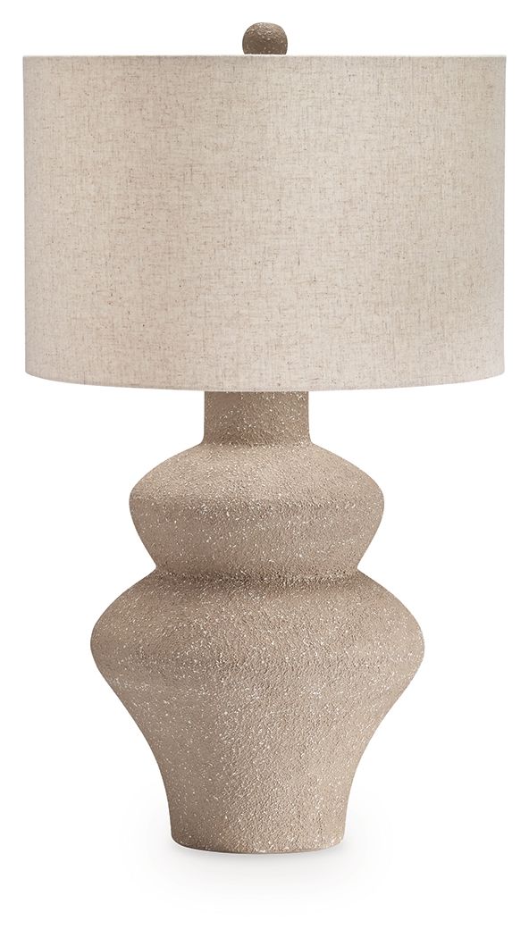 Beige metal table lamp with textured base and beige drum fabric shade