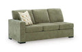 Moss green upholstered sofa with square arms, tufted cushions, and a light throw pillow