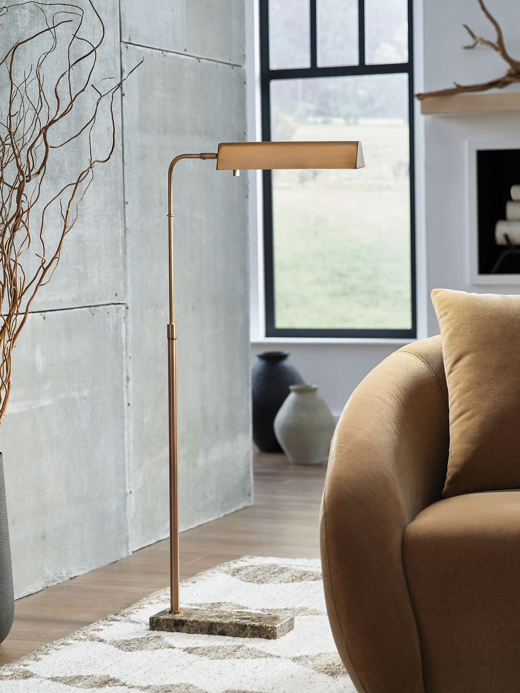 Bronze metal floor lamp with rectangular shade and curved support on stone base