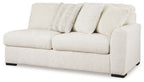 Ivory upholstered two-seat sofa with curved armrests, ribbed seat back, and cushions