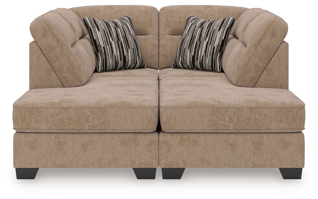Mocha sectional sofa with two chaise ends, tufted seat cushions and two patterned throw pillows