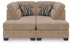 Mocha sectional sofa with two chaise ends, tufted seat cushions and two patterned throw pillows
