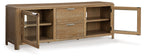 Light brown extra large TV stand with open cabinets, two drawers, and glass-pane door