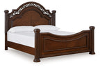 Dark brown poster bed frame with arched headboard and curved footboard, turned posts