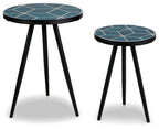 Round accent tables set with teal patterned tabletop, white grid, and black tapered legs