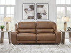 Brown power reclining sofa with two seats, split back, and adjustable headrests