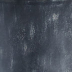 Dark stone-like textured surface