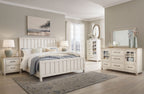 White panel bedroom set with bed, dresser, mirror, and nightstand