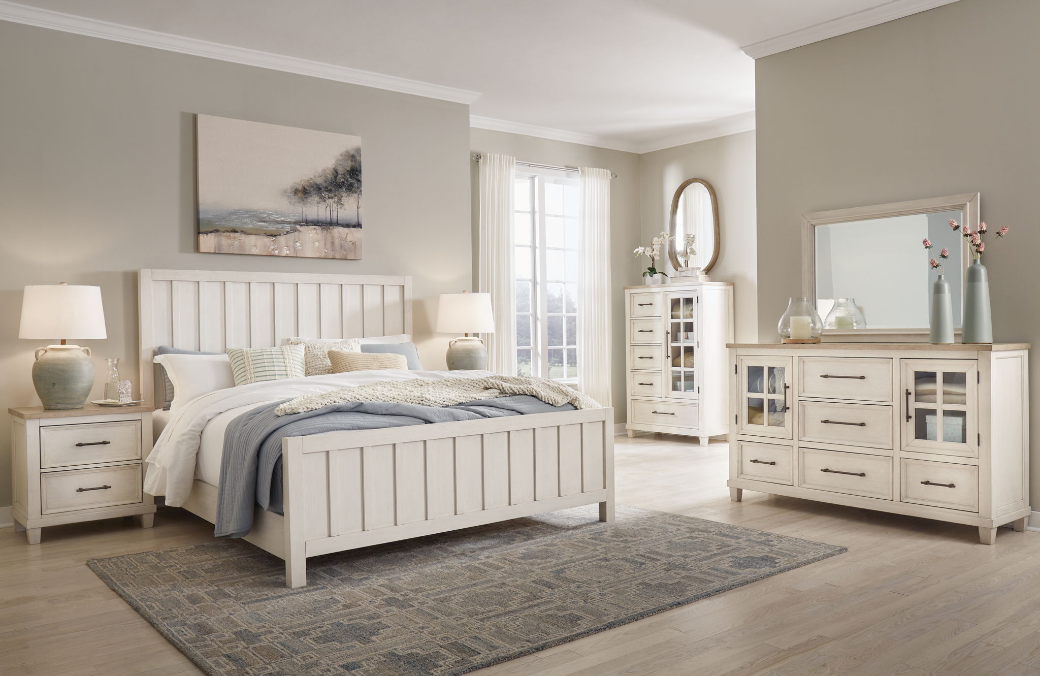 White panel bedroom set with bed, dresser, mirror, and nightstand