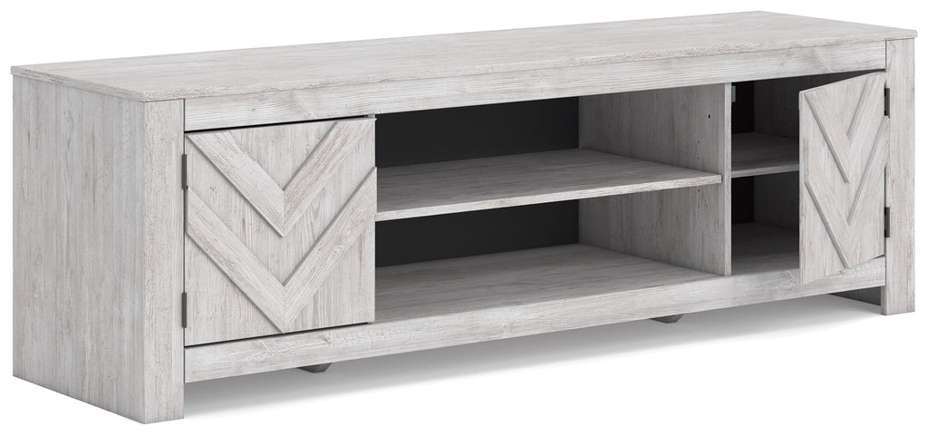 White TV stand with chevron cabinet doors and open center shelves