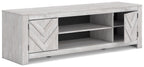 White TV stand with chevron cabinet doors and open center shelves