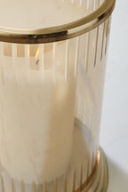 Aavinson glass candle holder with gold rim and visible flame through glass