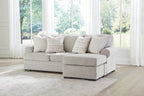 Gray fabric sofa chaise with plush cushions and throw pillows