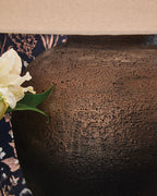 Brown metal lamp base with speckled, pitted finish