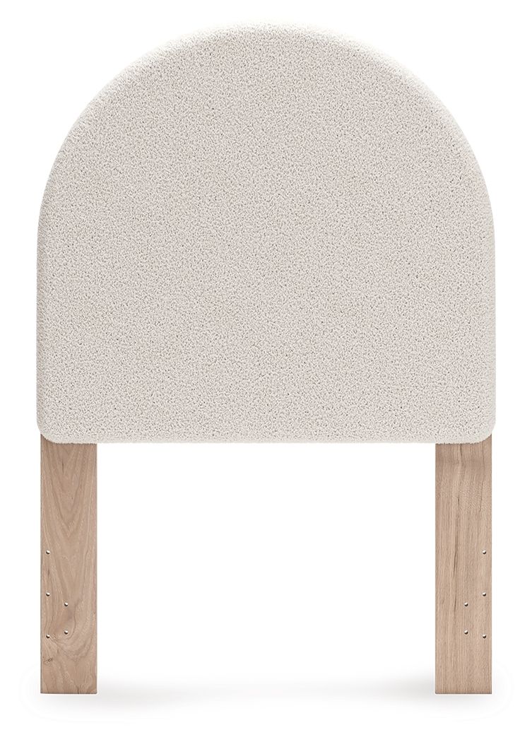 Upholstered panel headboard with arched white fabric and two wooden legs