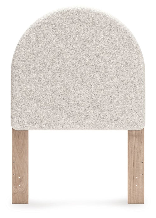 Upholstered panel headboard with arched white fabric and two wooden legs