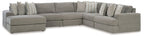Gray corner sectional with chaise-style seating and rows of accent pillows