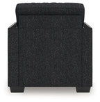 Black textured accent chair with rounded armrests and padded backrest