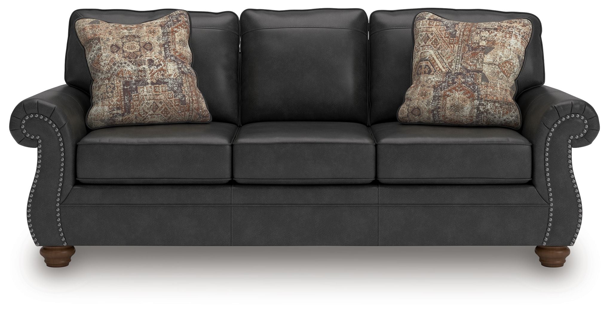 Chasemore sofa in dark gray with two patterned throw pillows and curved arms