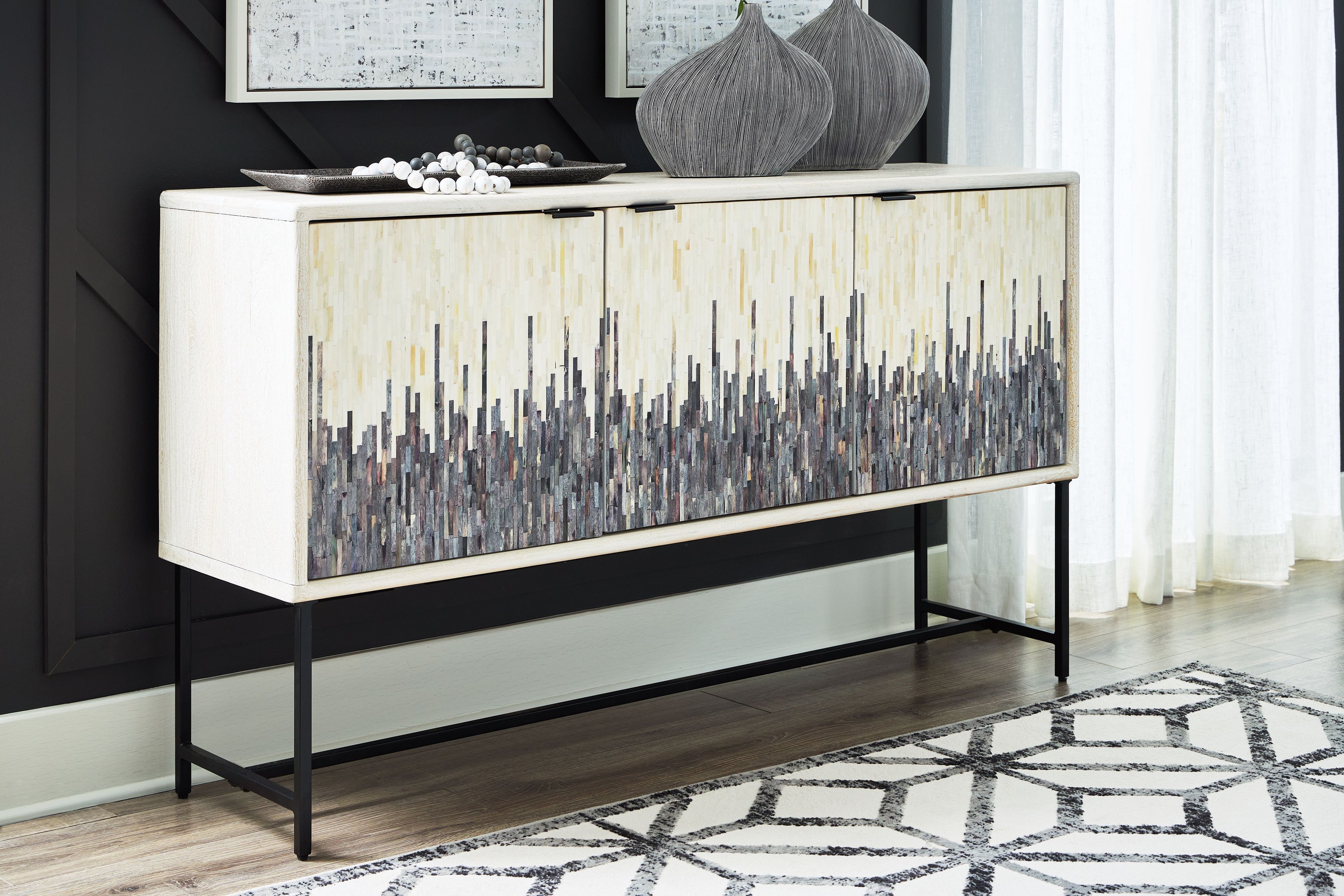 White accent cabinet with gray vertical line doors and black metal base legs