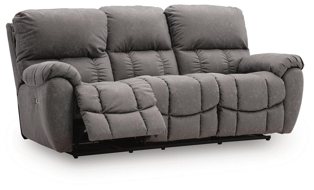 Gray reclining sofa with adjustable headrests, padded armrests, and tufted cushions