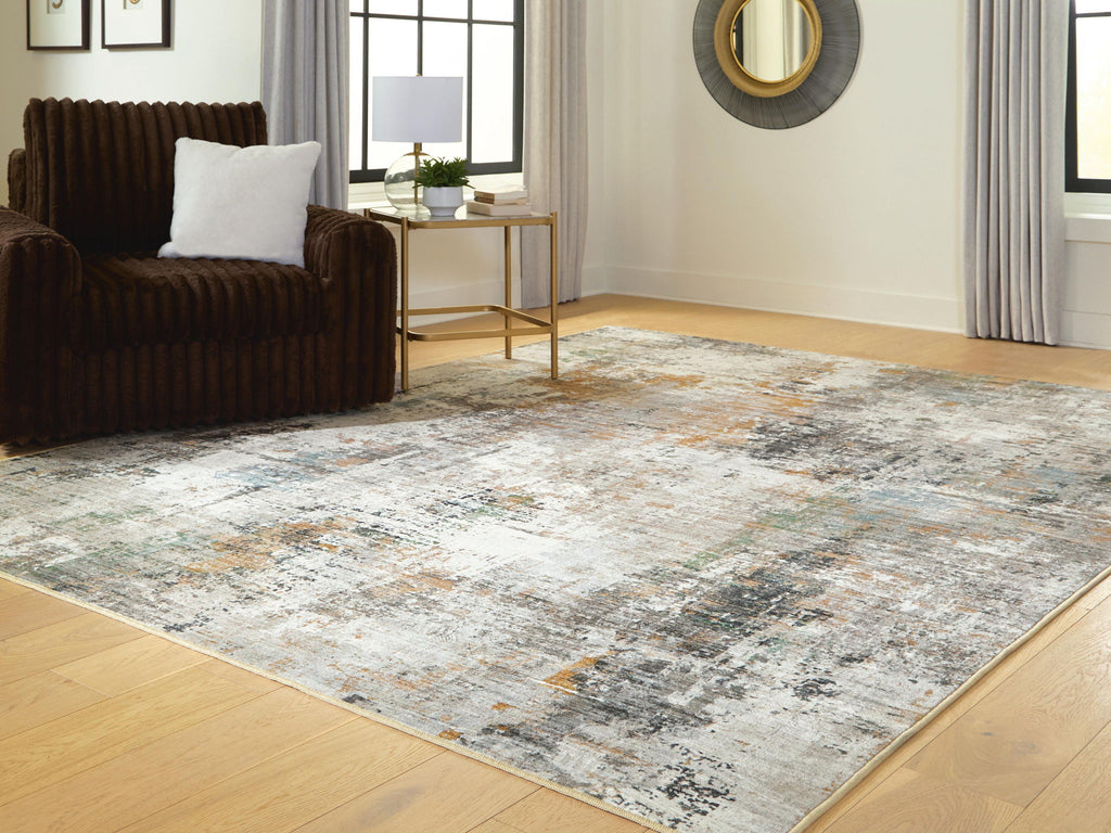 Abstract area rug with faded distressed design and low profile pile