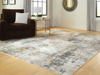 Abstract area rug with faded distressed design and low profile pile