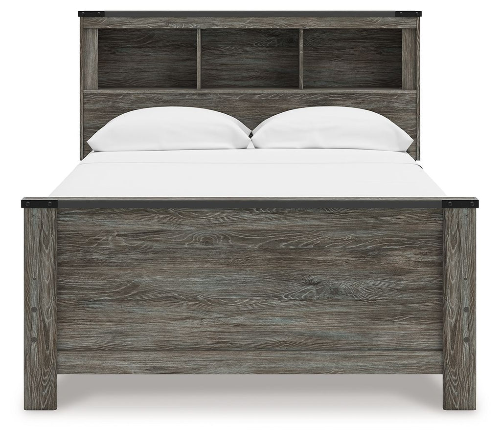 Gray bookcase panel bed with open-shelf headboard and white pillows on the mattress.