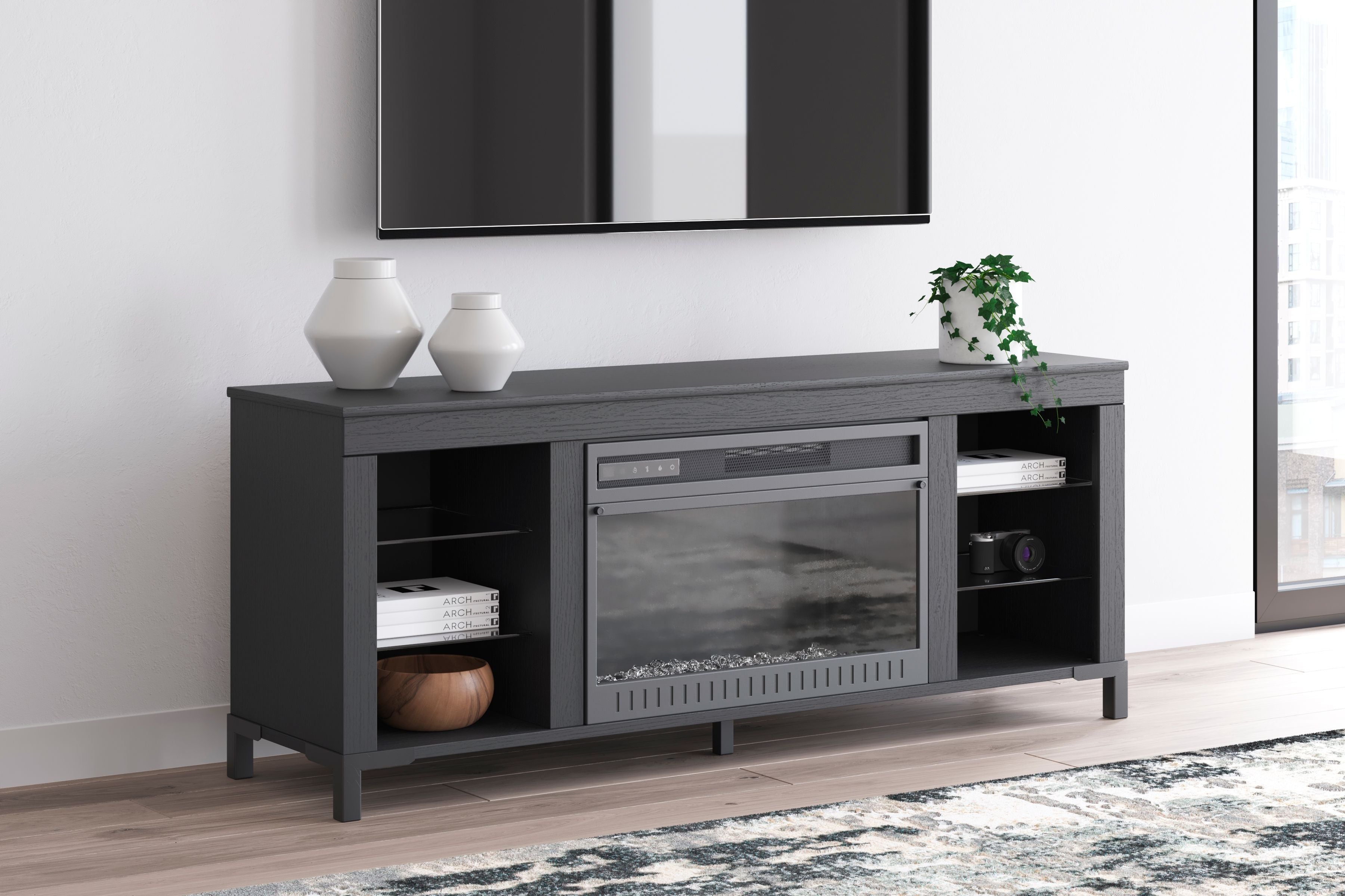 Black TV stand with electric fireplace insert, open shelves on both sides