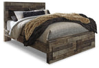 Dark gray panel bed frame with cozy bedding and throw, angled side three-quarter view