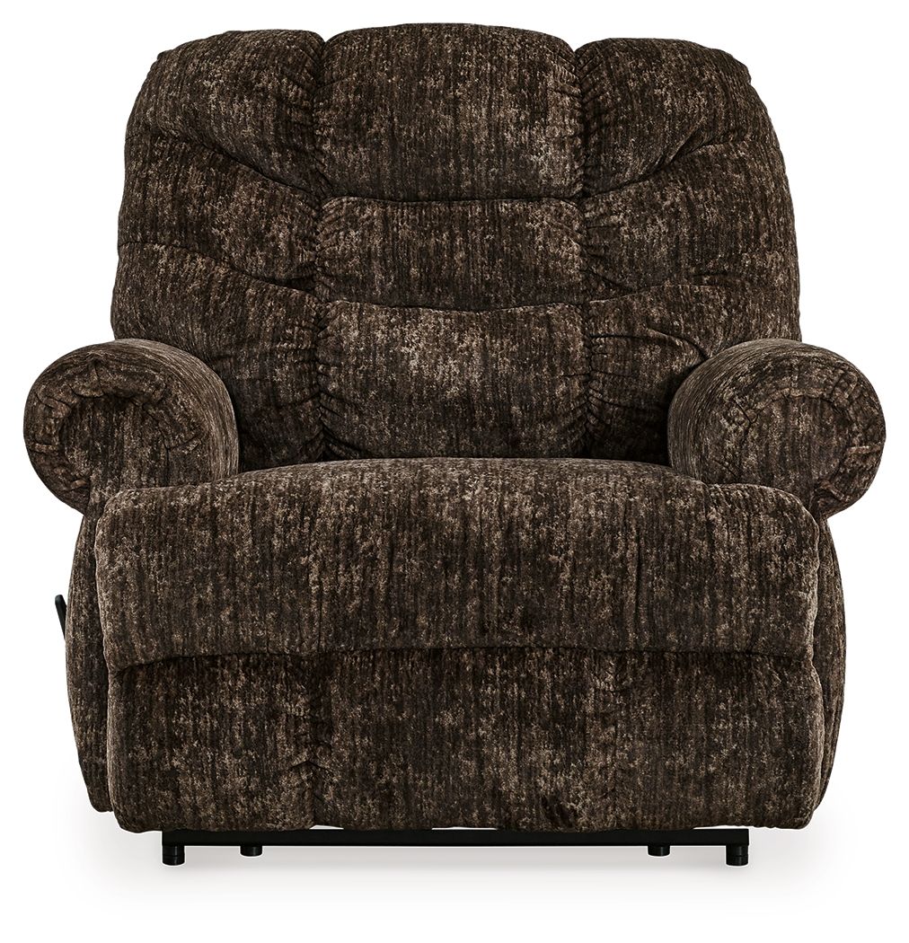 Chocolate brown fabric recliner with rounded arms, cushioned seat, and sturdy legs