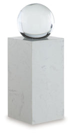 White glass sphere on white marble pedestal, front view