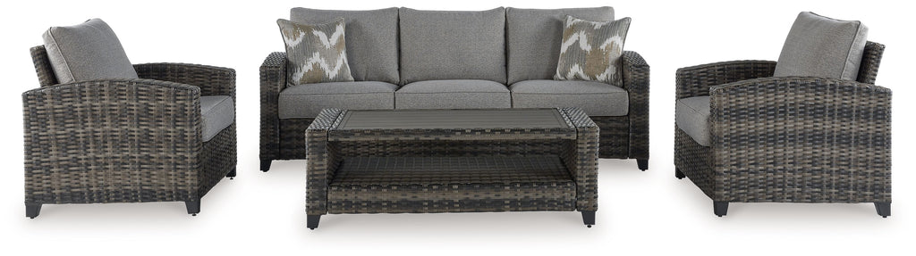 Gray wicker outdoor sofa set with two armchairs and central coffee table