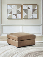 Oversized accent ottoman in taupe faux leather, square top, black base
