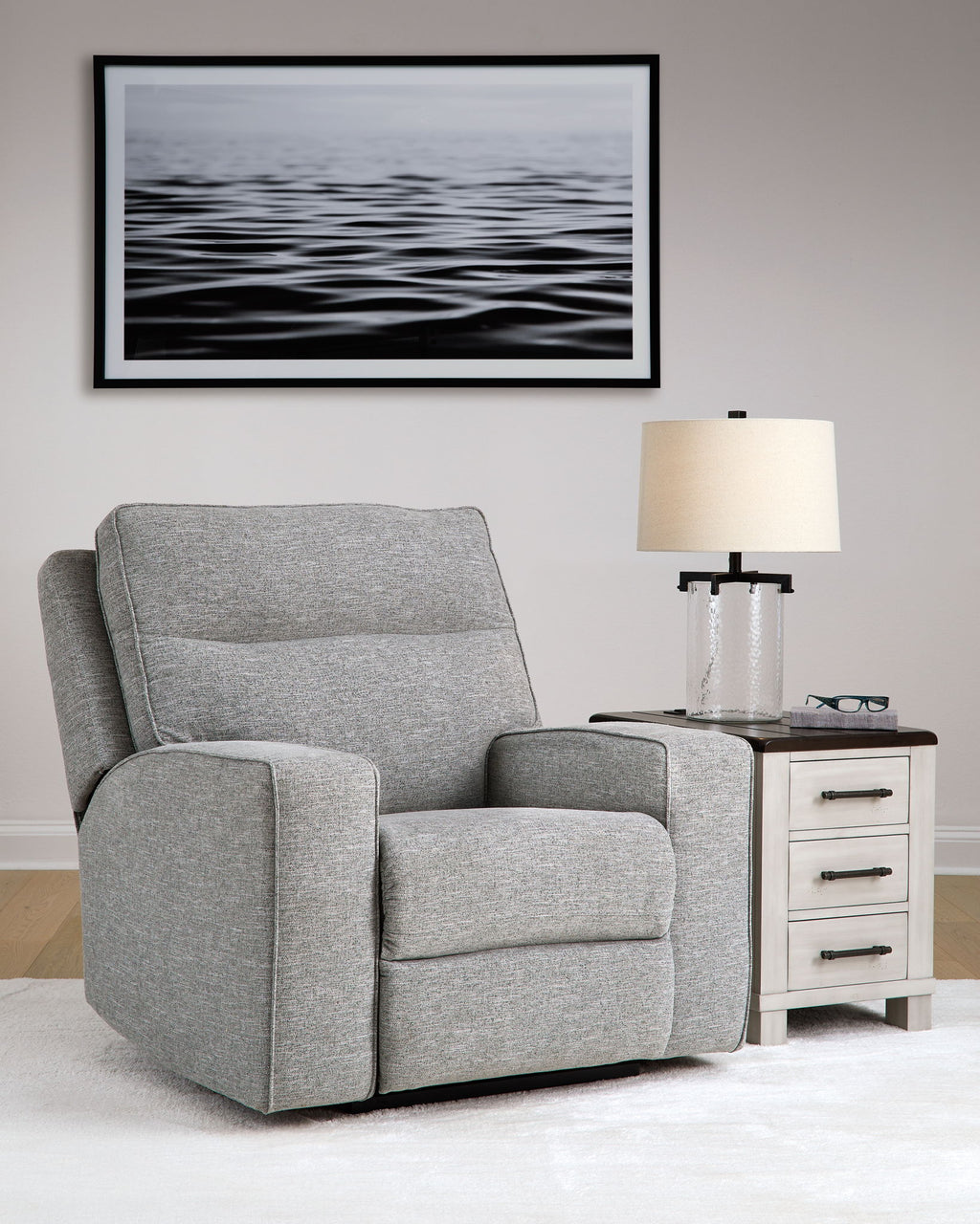 Pewter gray power recliner chair with adjustable headrest and thick padded seat